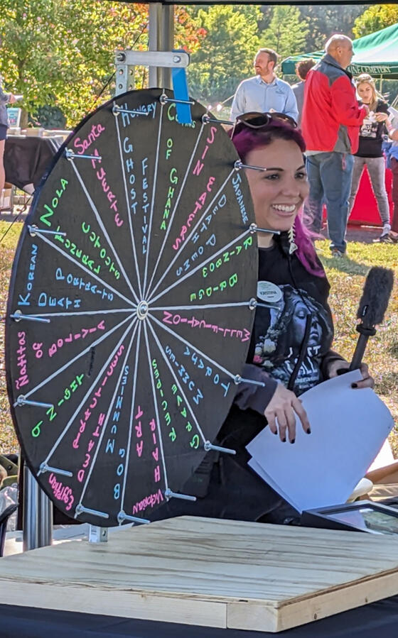 Last Call Festival 2023 Kristina Bohler Golden shares information with guests at the death positive education table.